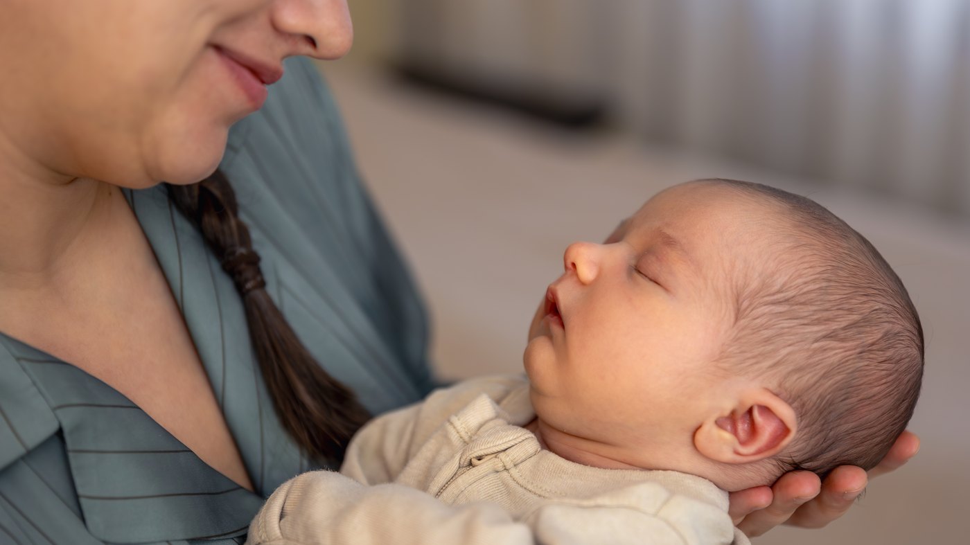 A mother holding her newborn baby